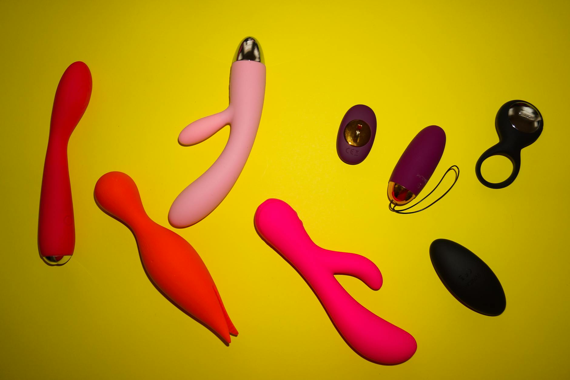 Blue silicone clitoral vibrator held in hand, symbolizing control and intentional pleasure